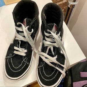 Womens // Big Kid’s 5.5 or Mens size 4 Vans black and white high tops.